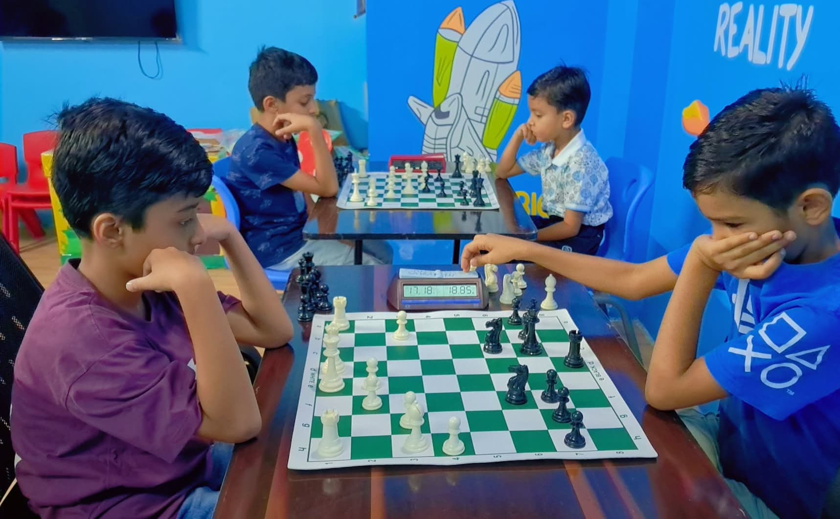 Children practicing endgame techniques in chess class