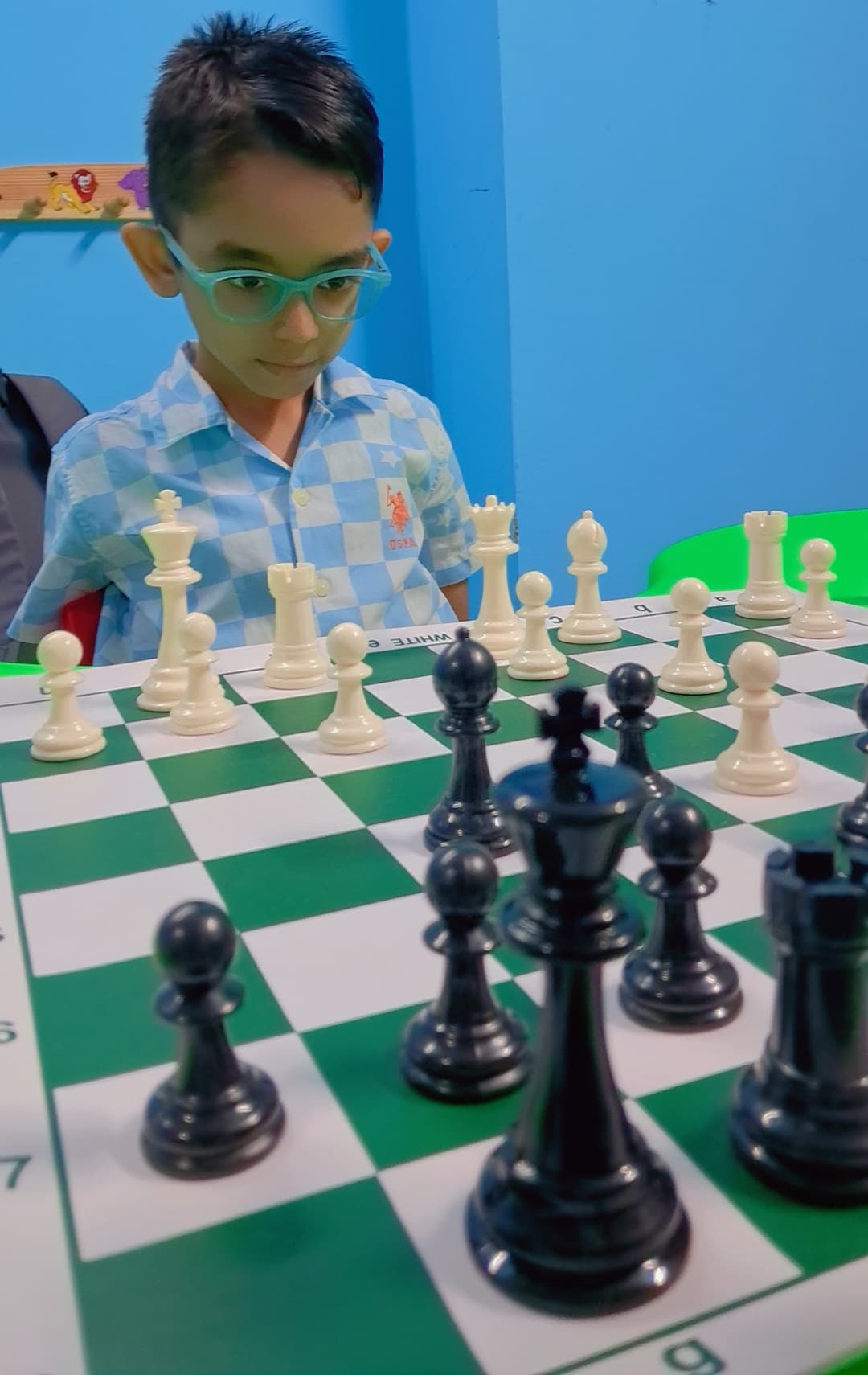 Students competing in organized chess tournament hall