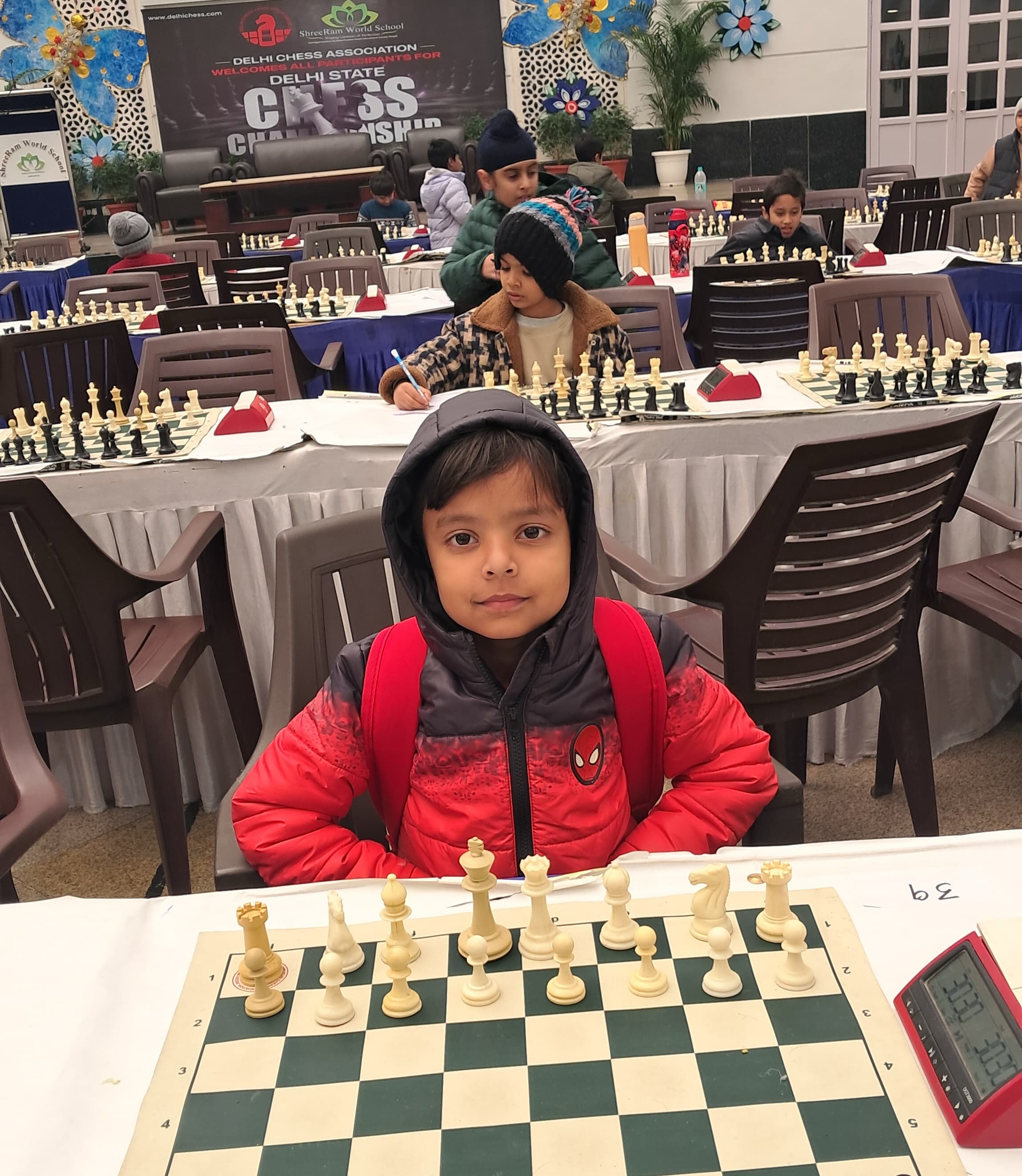 Young student preparing chess opening strategy