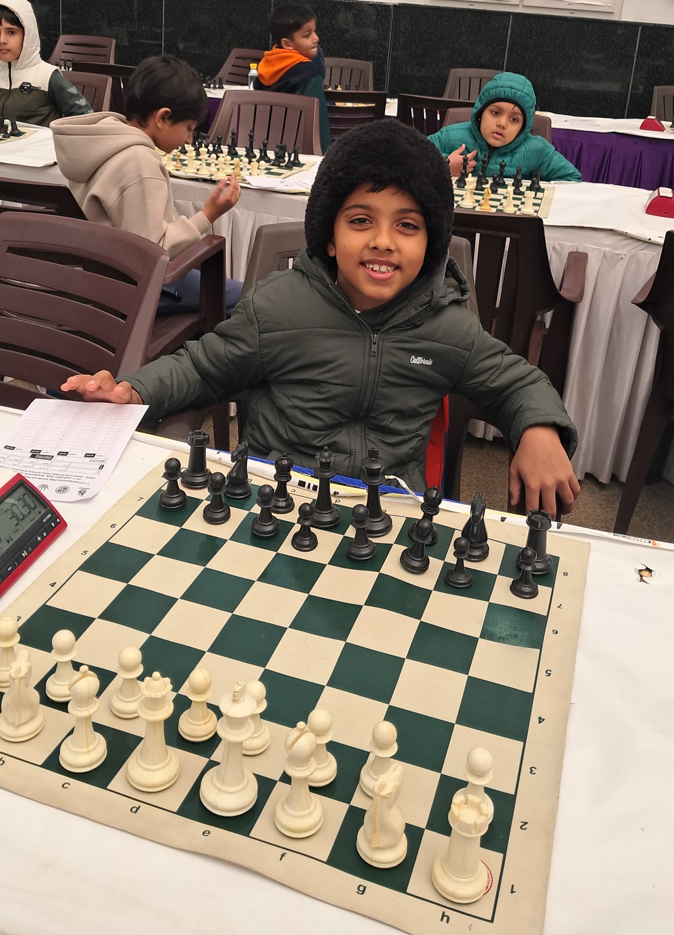 Children practicing endgame techniques in academy session
