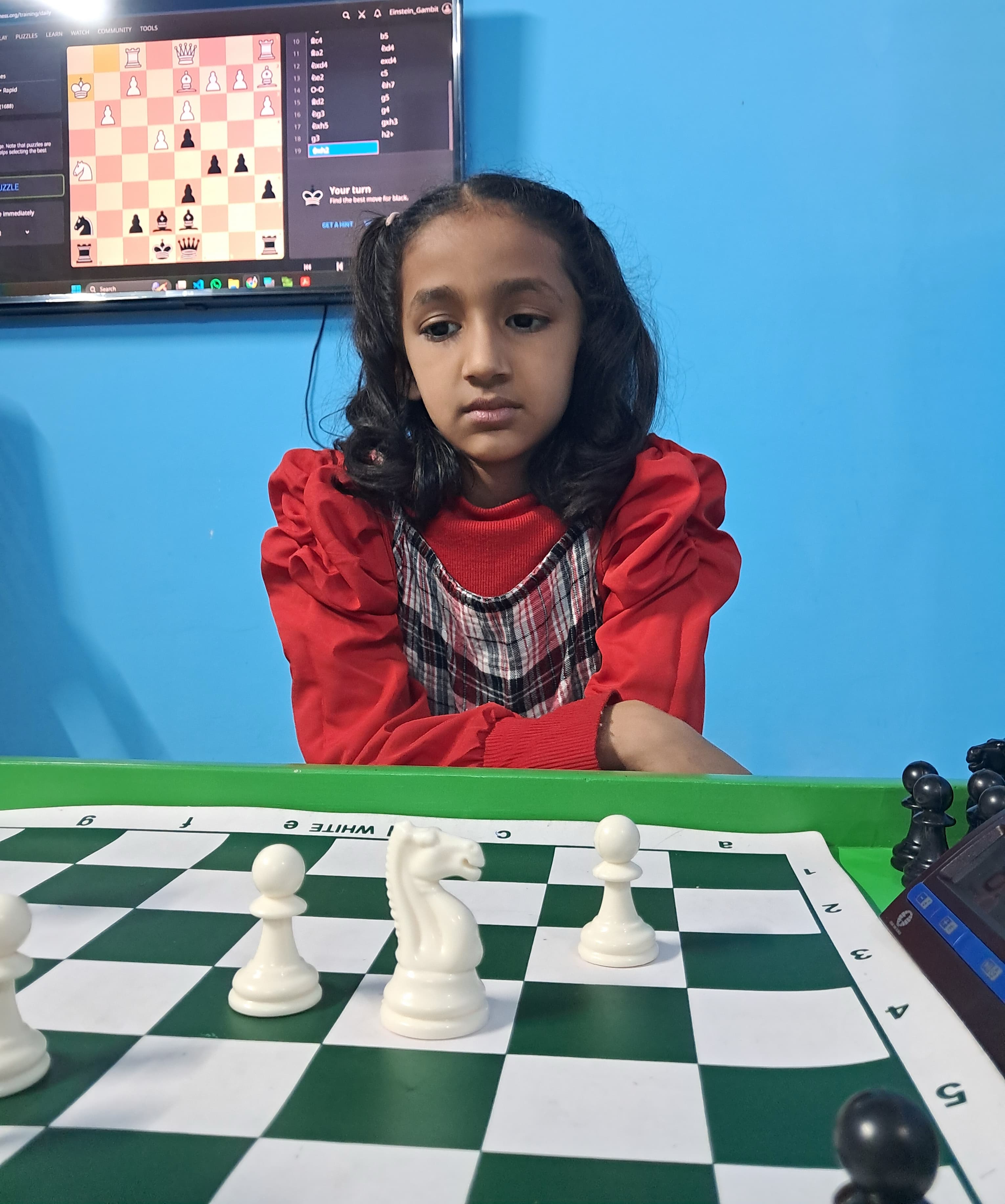 Focused chess student reviewing position after move