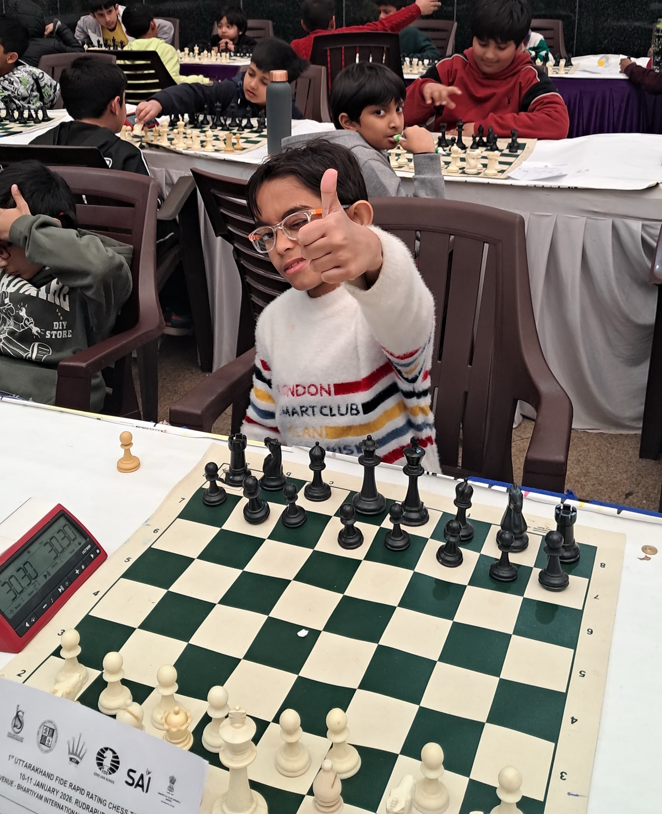Young child preparing for competitive chess tournament
