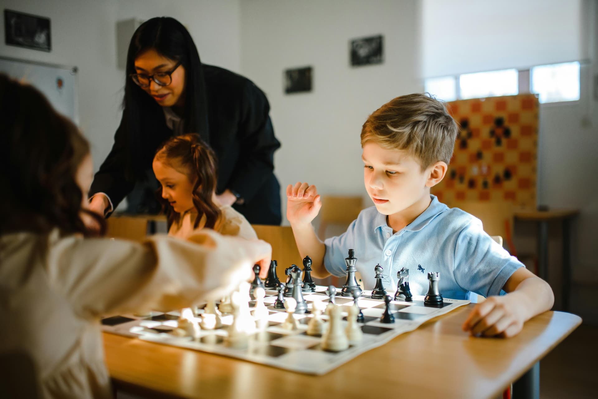 Children learning chess in a calm and structured environment at Nimzo Academy